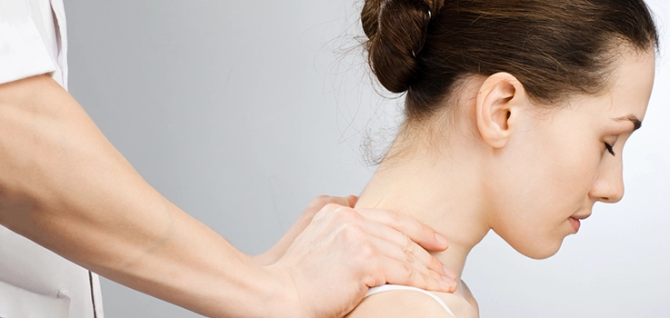 Chiropractor treating headaches